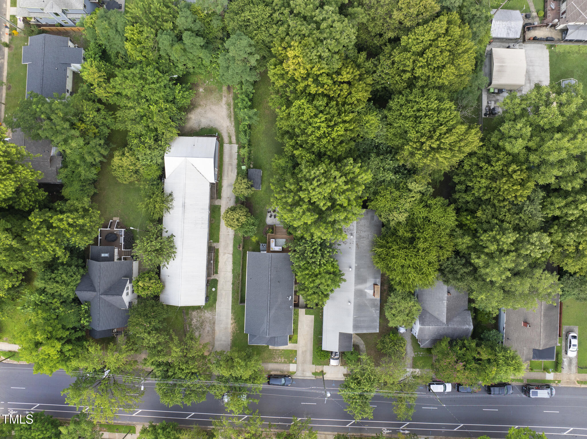 1010 South Person Street Raleigh, NC 27601 - Photo 31 of 41 a view of a multi story building with a yard and large trees