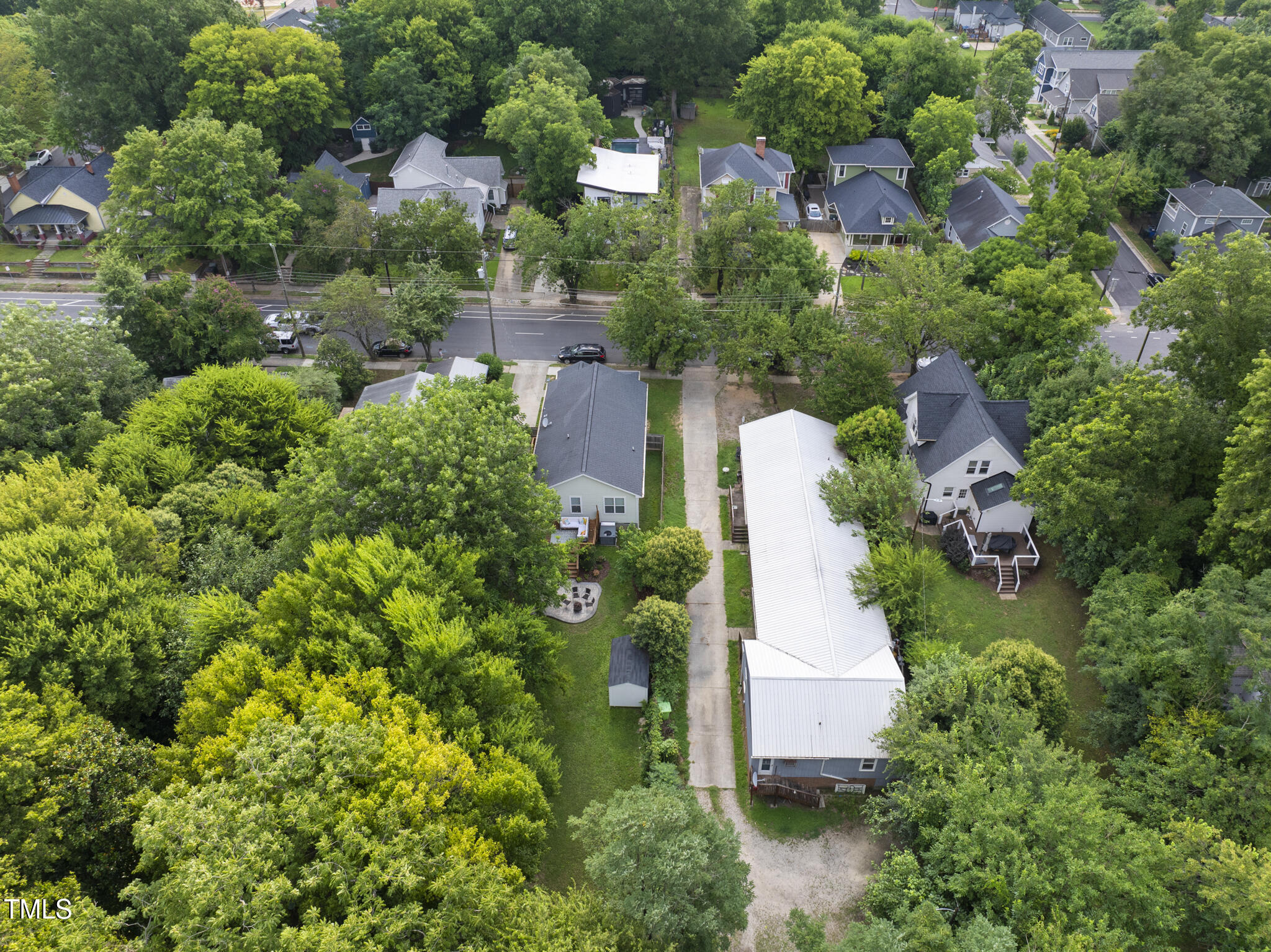 1010 South Person Street Raleigh, NC 27601 - Photo 39 of 41 an aerial view of a house with a yard and lake view