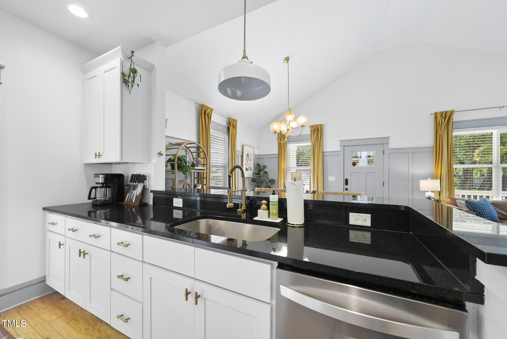 1010 South Person Street Raleigh, NC 27601 - Photo 9 of 41 a kitchen with stainless steel appliances granite countertop a sink a stove and cabinets