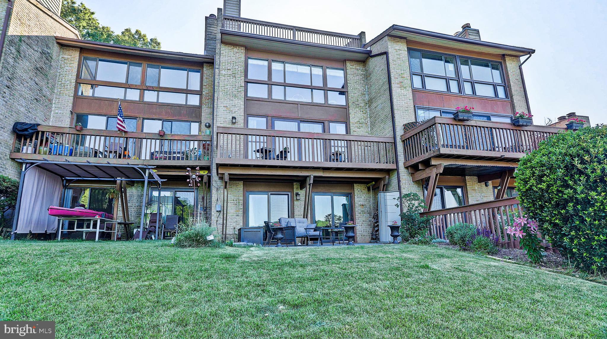 11210 Lagoon Lane Reston, VA 20191 - Photo 2 of 63 Rear elevation with yard