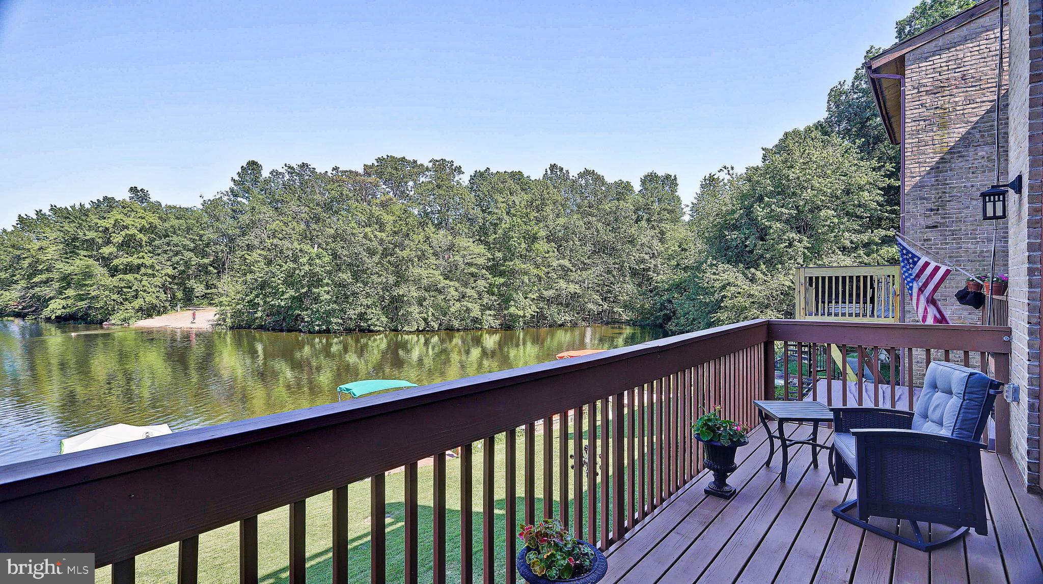 11210 Lagoon Lane Reston, VA 20191 - Photo 11 of 63 Main level deck with view