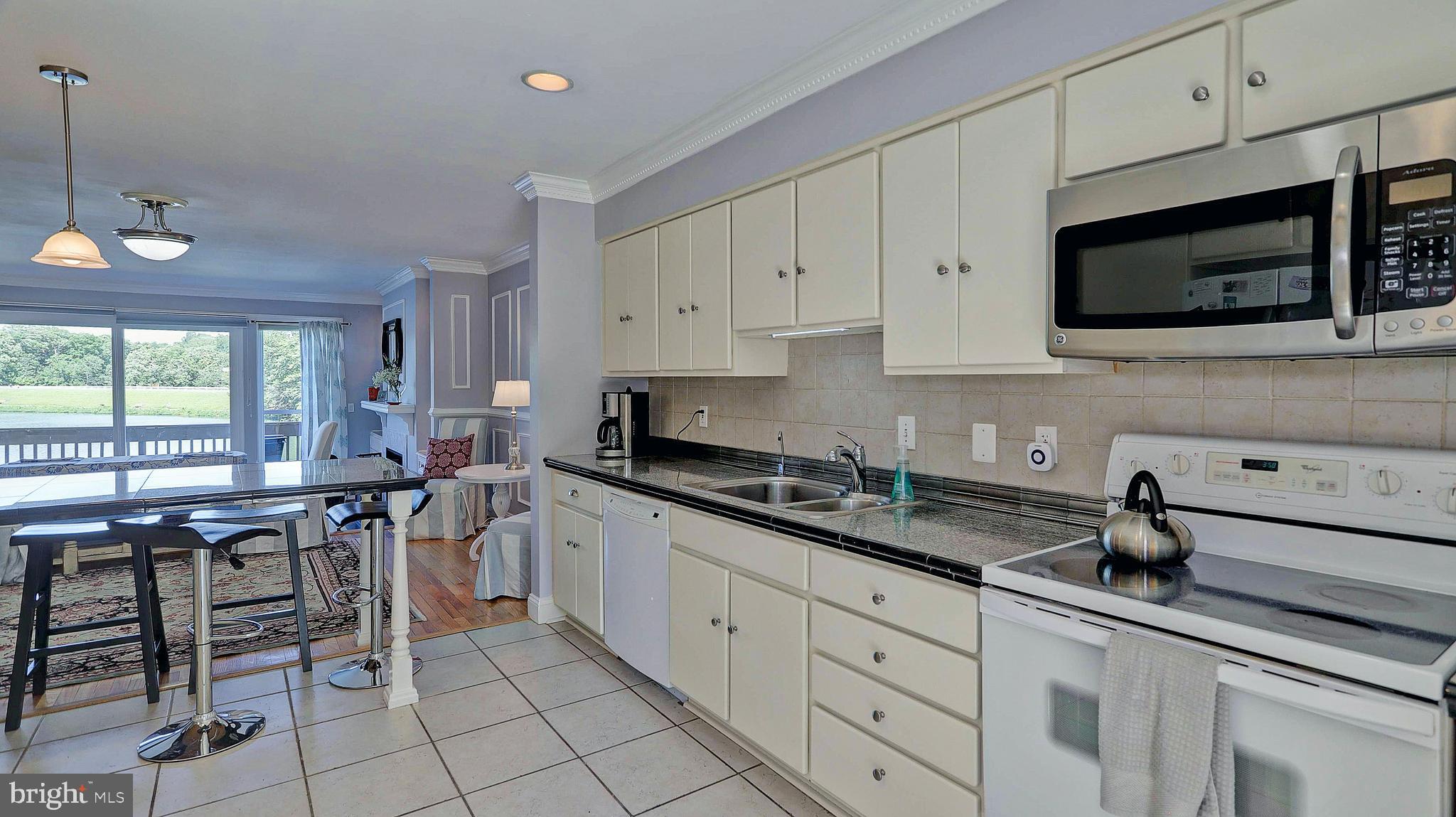 11210 Lagoon Lane Reston, VA 20191 - Photo 13 of 63 Kitchen to family area