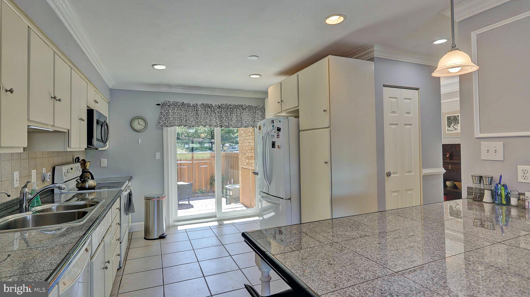 11210 Lagoon Lane Reston, VA 20191 - Photo 16 of 63 Kitchen with slider to fenced front patio
