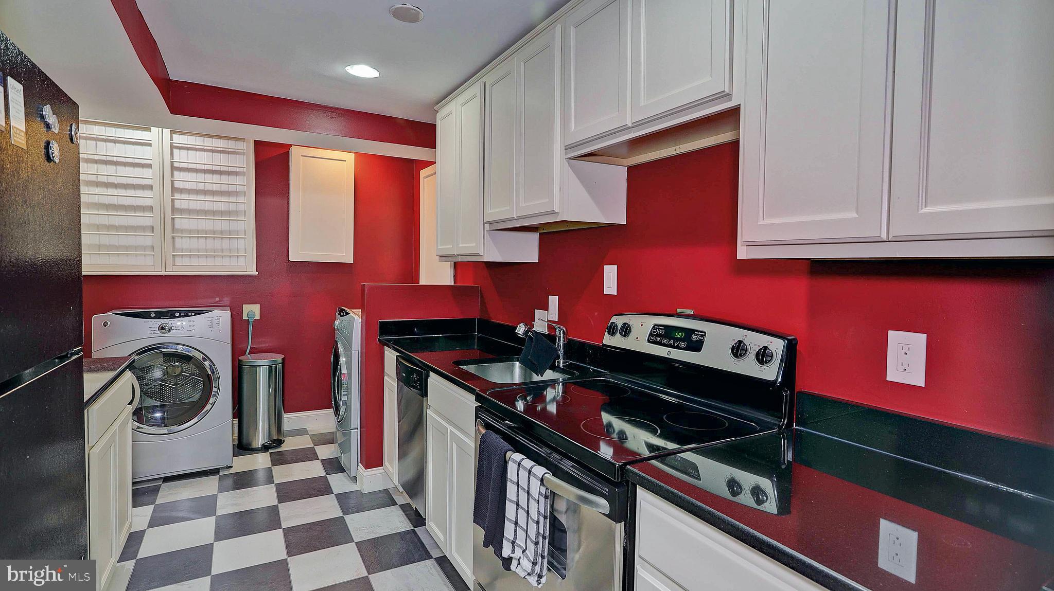 11210 Lagoon Lane Reston, VA 20191 - Photo 29 of 63 Lower level kitchen and laundry room