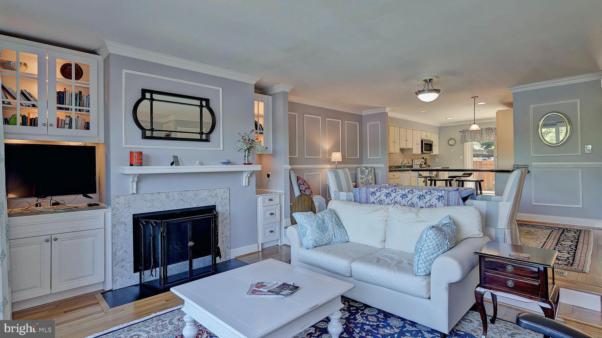 11210 Lagoon Lane Reston, VA 20191 - Photo 6 of 63 Living area with FPL and custom built-ins