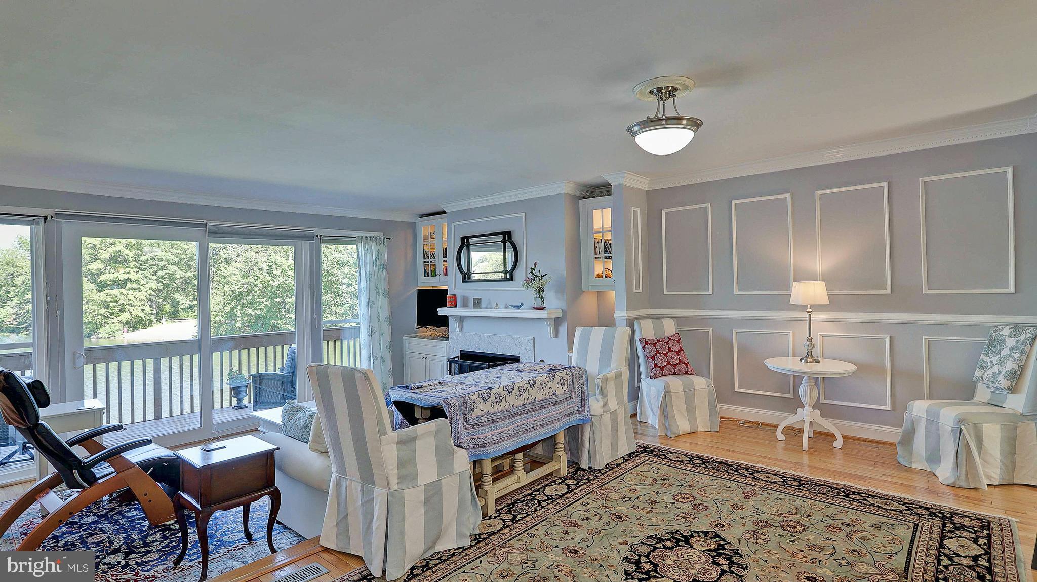 11210 Lagoon Lane Reston, VA 20191 - Photo 7 of 63 Dining/Living room with HWF's, view of lake
