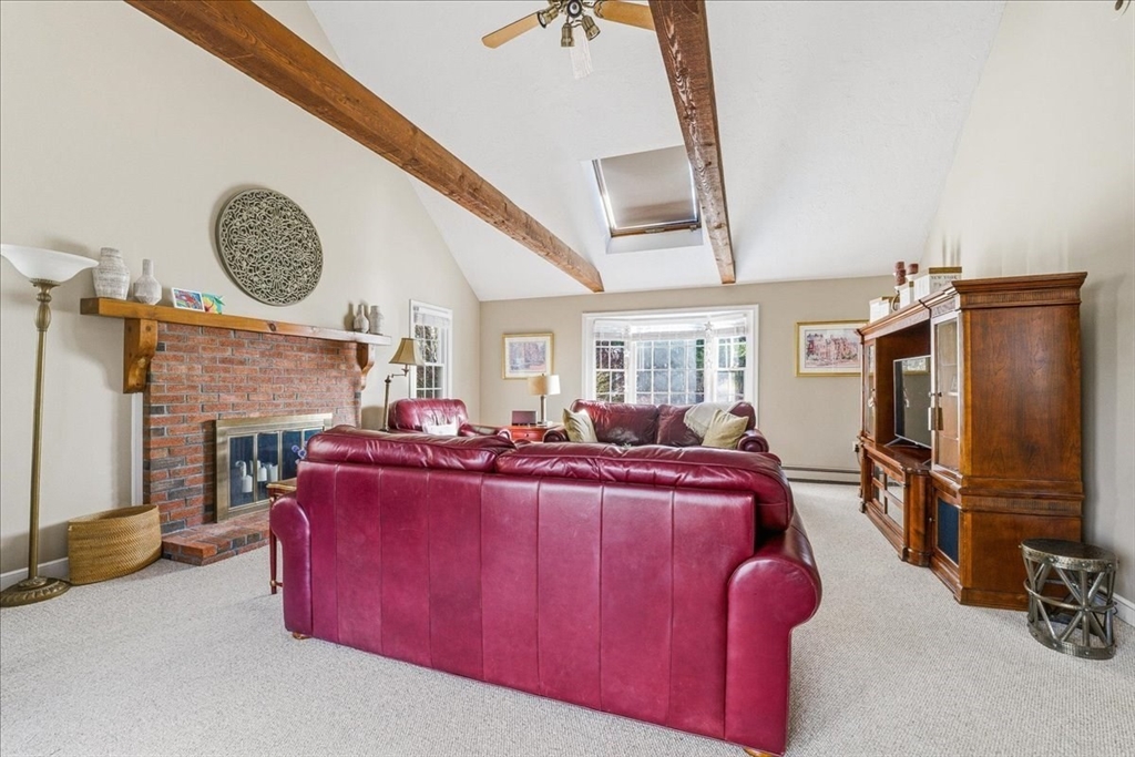 33 1st Parish Lane Hanover, MA 02339 - Photo 11 of 35 a bed room with a bed chair and a fireplace