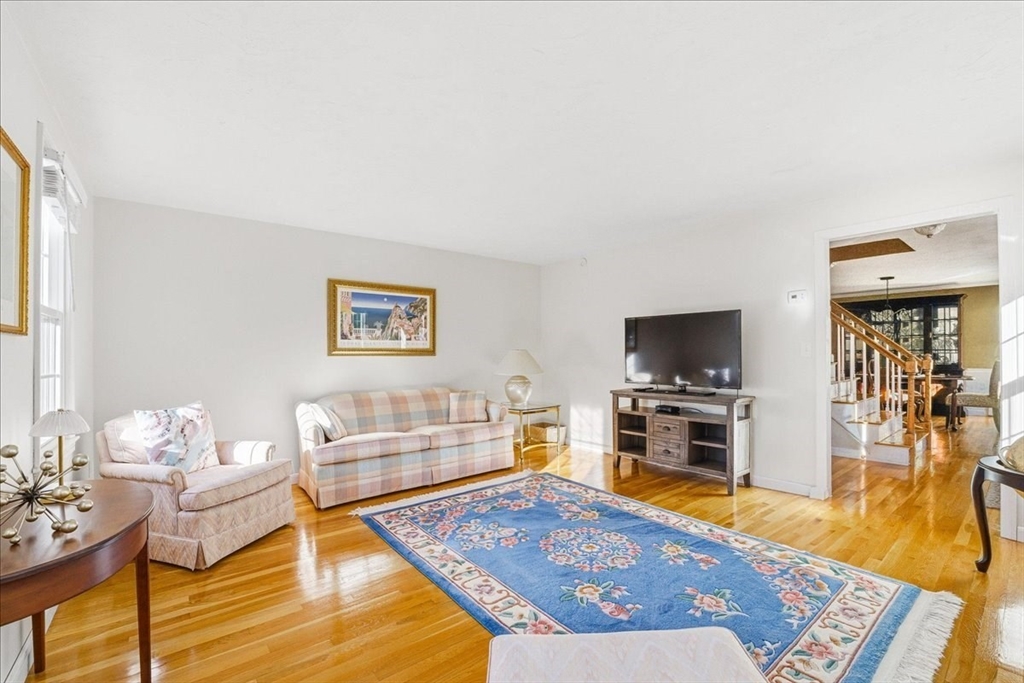 33 1st Parish Lane Hanover, MA 02339 - Photo 15 of 35 a living room with furniture and a flat screen tv