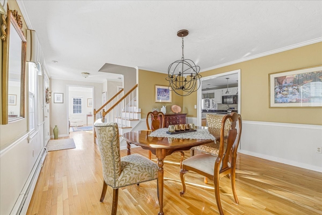 33 1st Parish Lane Hanover, MA 02339 - Photo 18 of 35 a view of a dining room with furniture and wooden floor