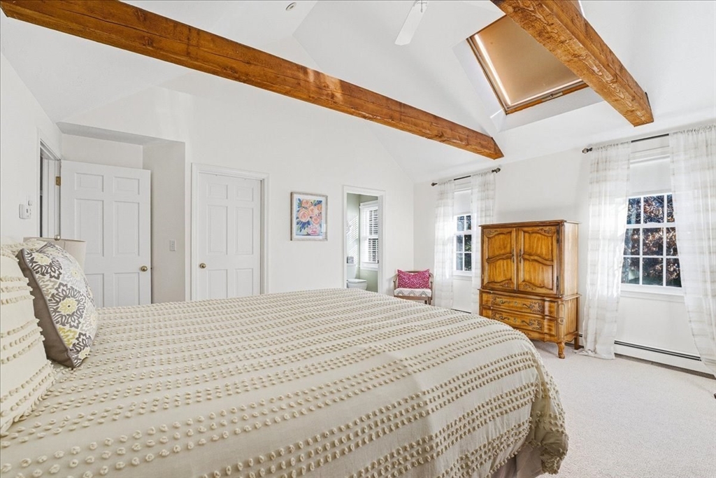 33 1st Parish Lane Hanover, MA 02339 - Photo 21 of 35 a bedroom with a bed and a large window