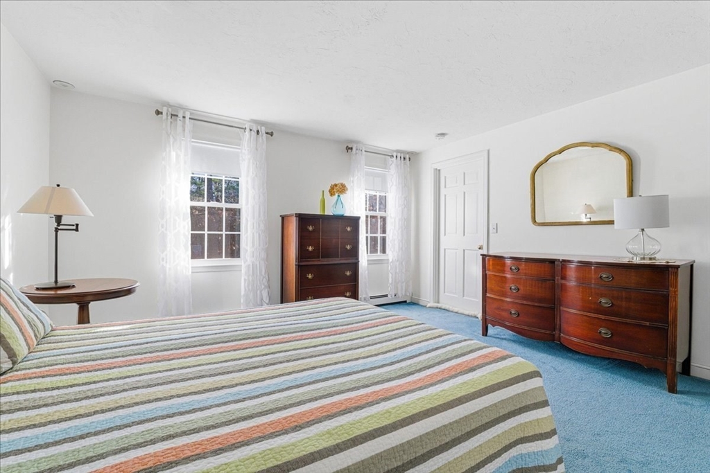33 1st Parish Lane Hanover, MA 02339 - Photo 24 of 35 a bedroom with a bed and a dresser