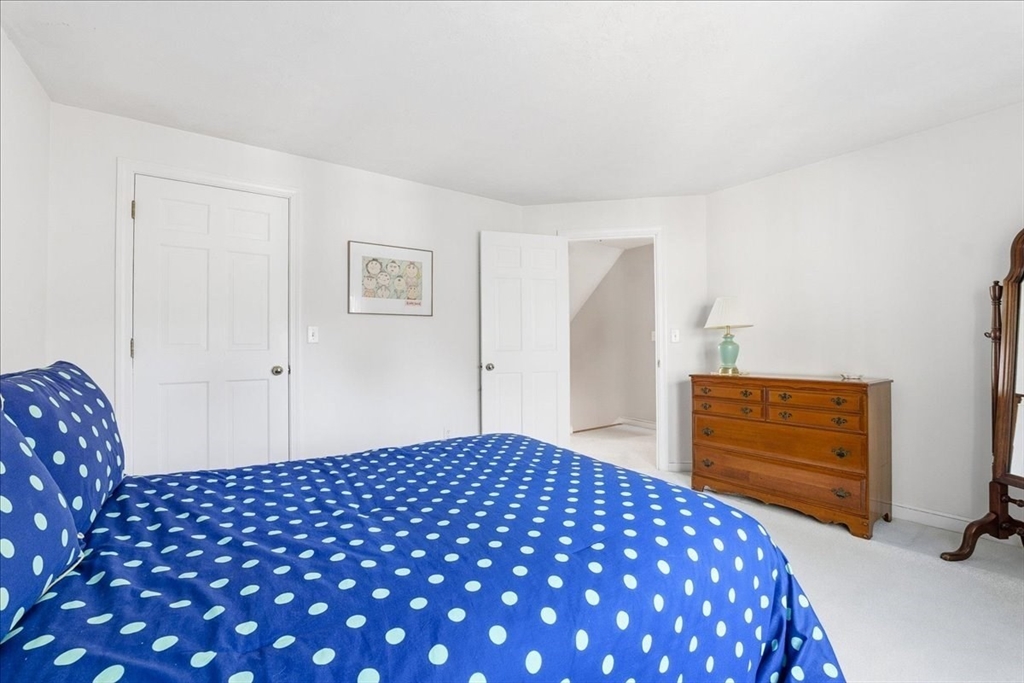 33 1st Parish Lane Hanover, MA 02339 - Photo 25 of 35 a bedroom with a bed and cabinets