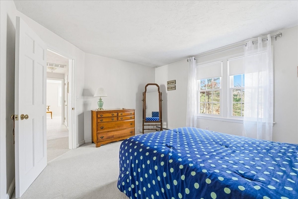 33 1st Parish Lane Hanover, MA 02339 - Photo 26 of 35 a bedroom with a bed and a dresser