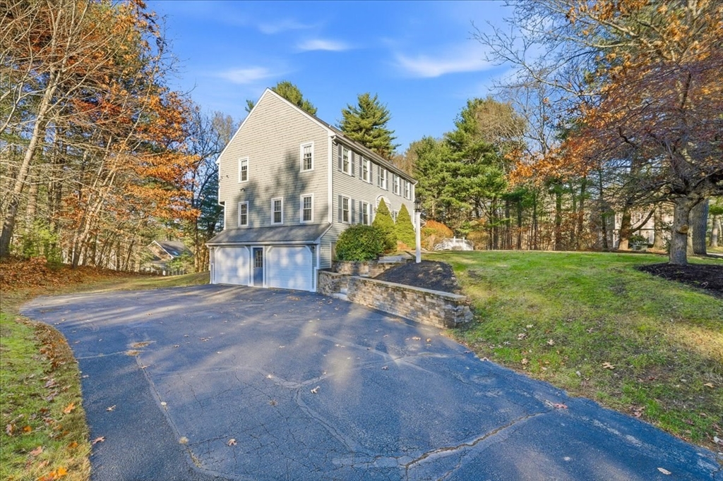33 1st Parish Lane Hanover, MA 02339 - Photo 3 of 35 a front view of a house with a yard and garage