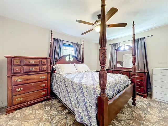 a bed room with a bed and a dresser