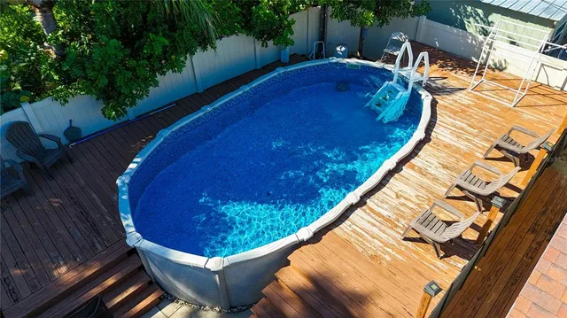 a view of swimming pool from a balcony