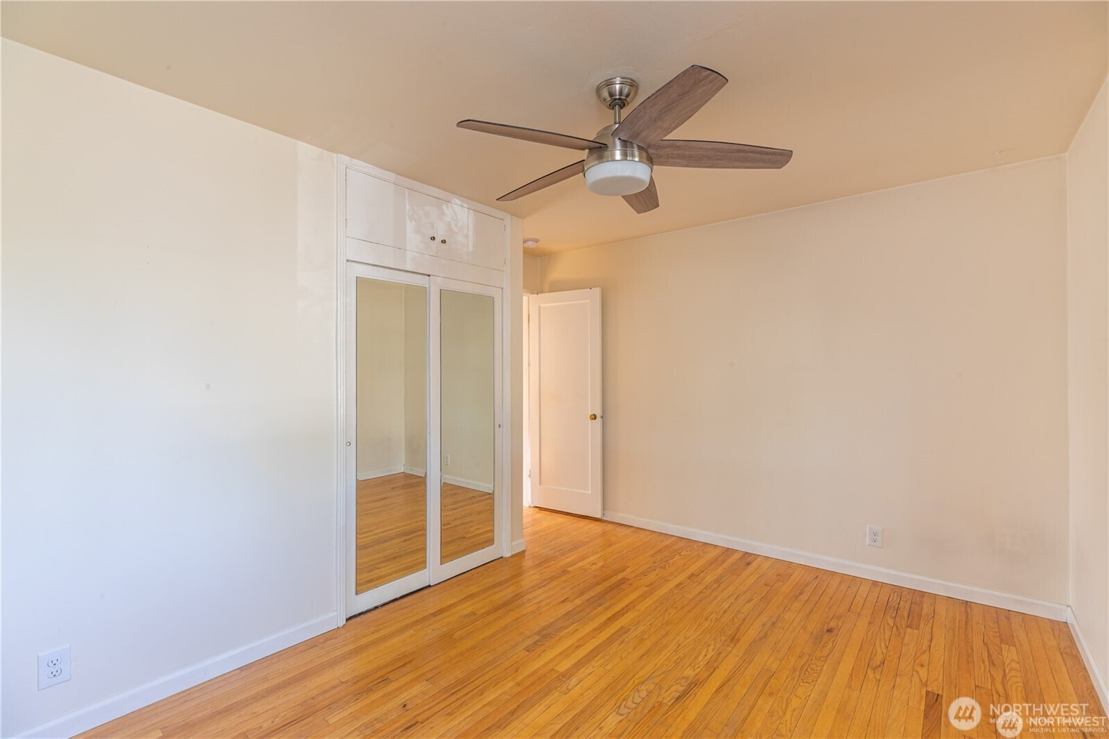 8601 36th Avenue Southwest Seattle, WA 98126 - Photo 16 of 28 a view of a big room with wooden floor closet and windows