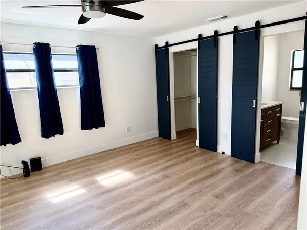 wooden floor in an empty room and a window
