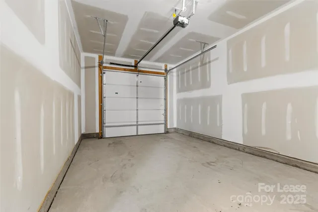 a view of a garden with a building in the background