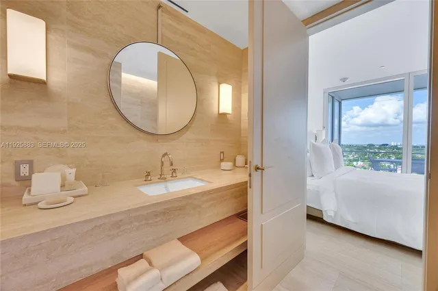 a bathroom with a sink and a mirror