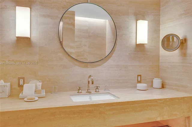 a bathroom with a sink and a mirror