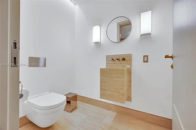 a bathroom with a toilet and a sink