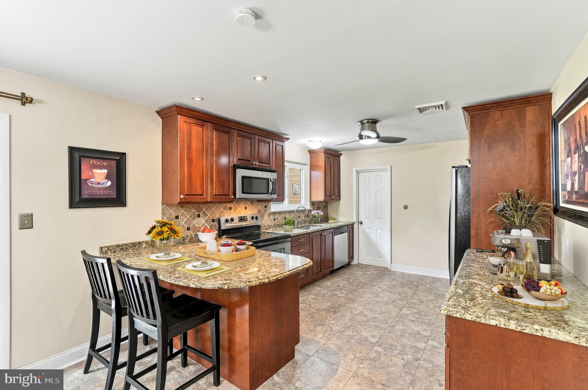 3203 Nottingham Road Norristown, PA 19403 - Photo 9 of 39 CUSTOM KITCHEN WITH BREAKFAST COUNTER