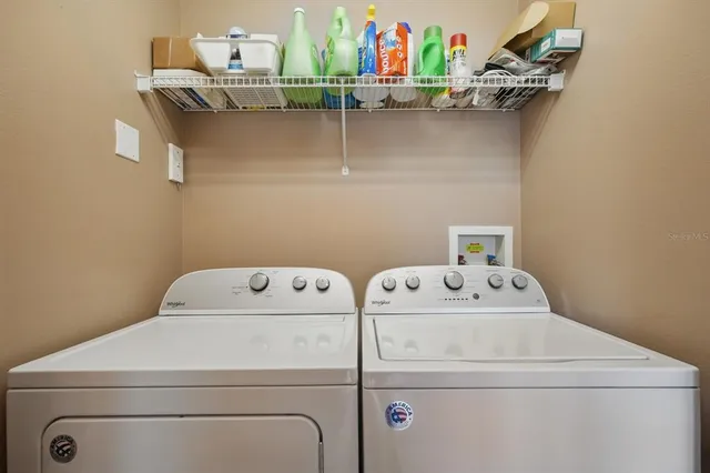 a bedroom with furniture and a flat screen tv