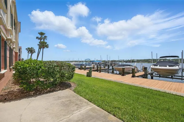 a front view of a building with a garden