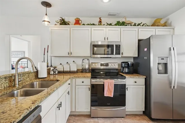 an aerial view of a house with swimming pool