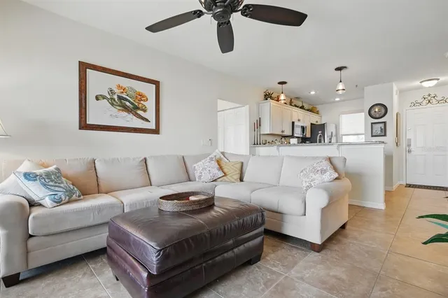 a kitchen with stainless steel appliances granite countertop a sink and a refrigerator