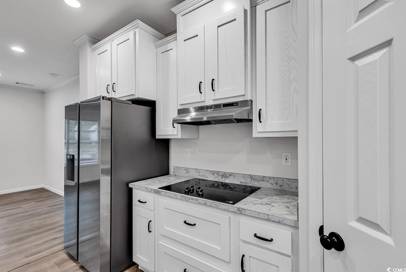 1529 Bucksport Road Conway, SC 29527 - Photo 14 of 31 Kitchen featuring ornamental molding, white cabinets, appliances with stainless steel finishes, plenty of natural light, and recessed lighting