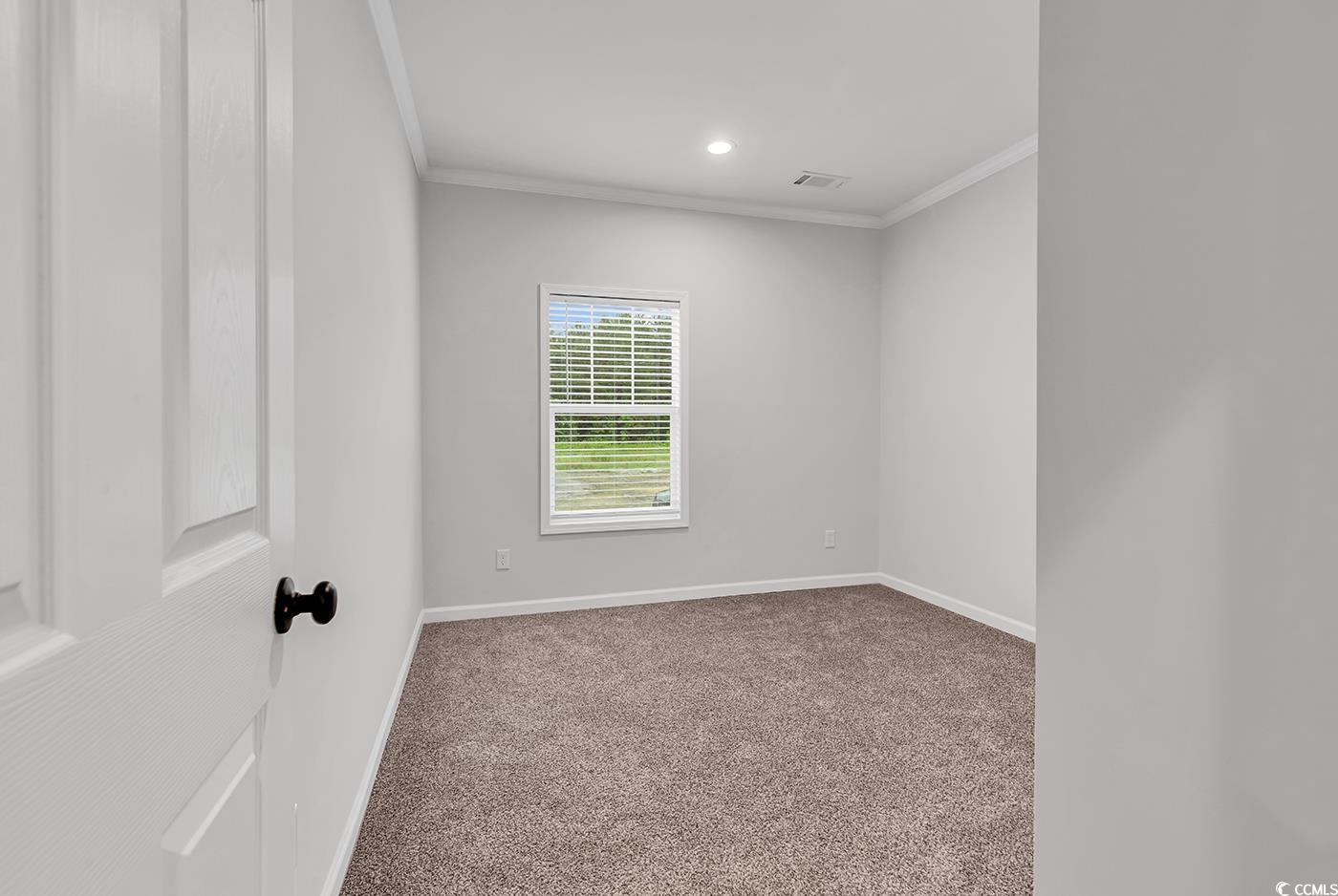 1529 Bucksport Road Conway, SC 29527 - Photo 18 of 31 Unfurnished dining area with light wood-style flooring, ornamental molding, and recessed lighting