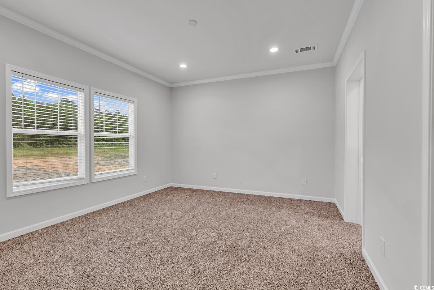 1529 Bucksport Road Conway, SC 29527 - Photo 24 of 31 Unfurnished bedroom featuring carpet flooring and ornamental molding
