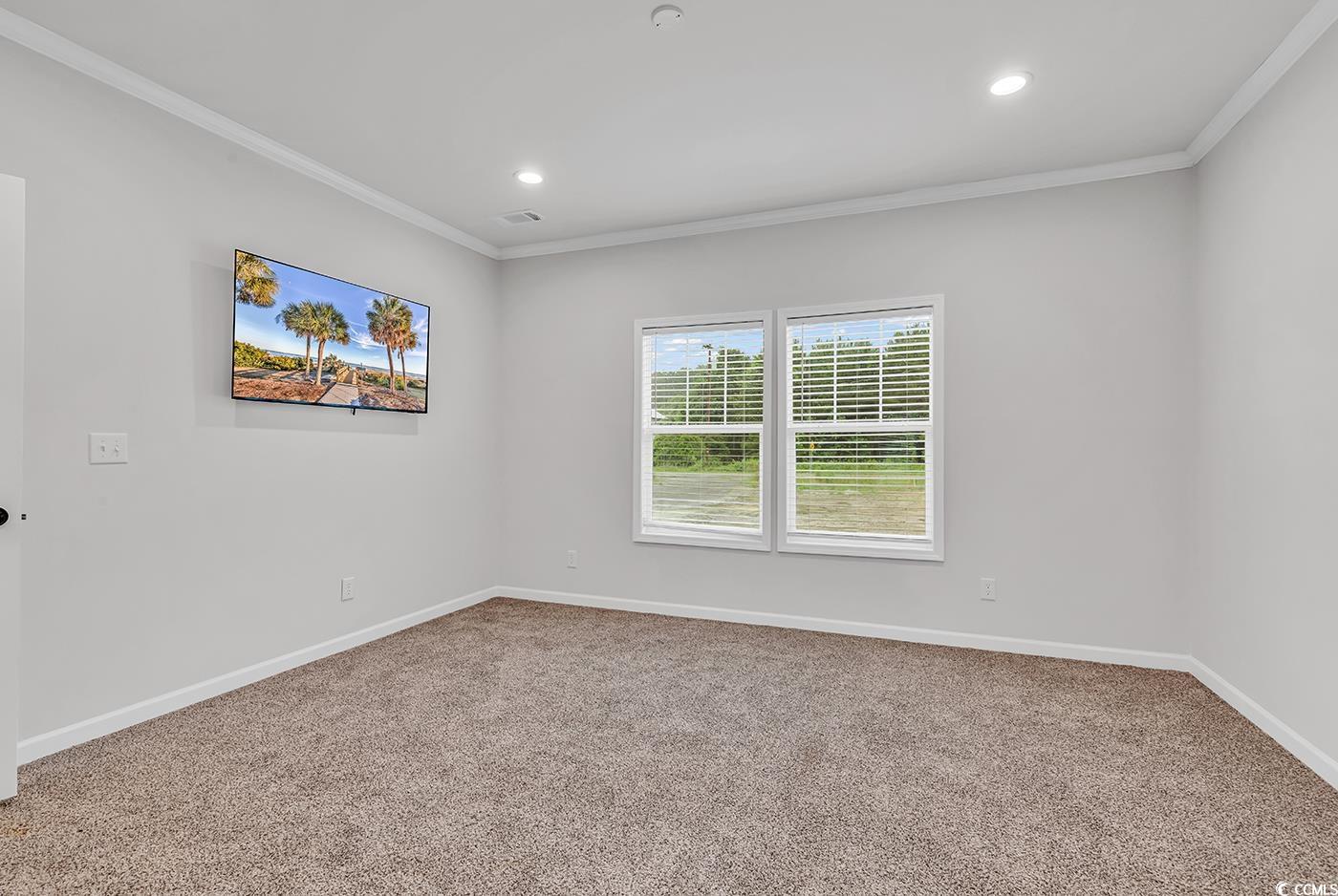1529 Bucksport Road Conway, SC 29527 - Photo 26 of 31 Unfurnished master bedroom featuring ornamental molding, a spacious closet, carpet flooring, recessed lighting, and ensuite bath