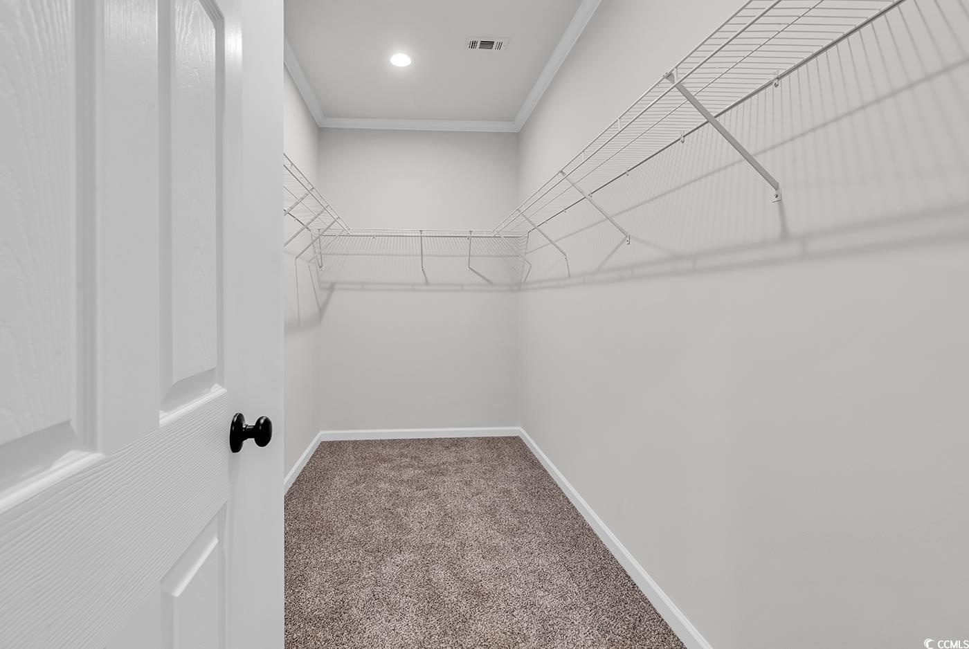 1529 Bucksport Road Conway, SC 29527 - Photo 31 of 31 Full master bath featuring crown molding, double vanity, a stall shower, and dark wood-style flooring