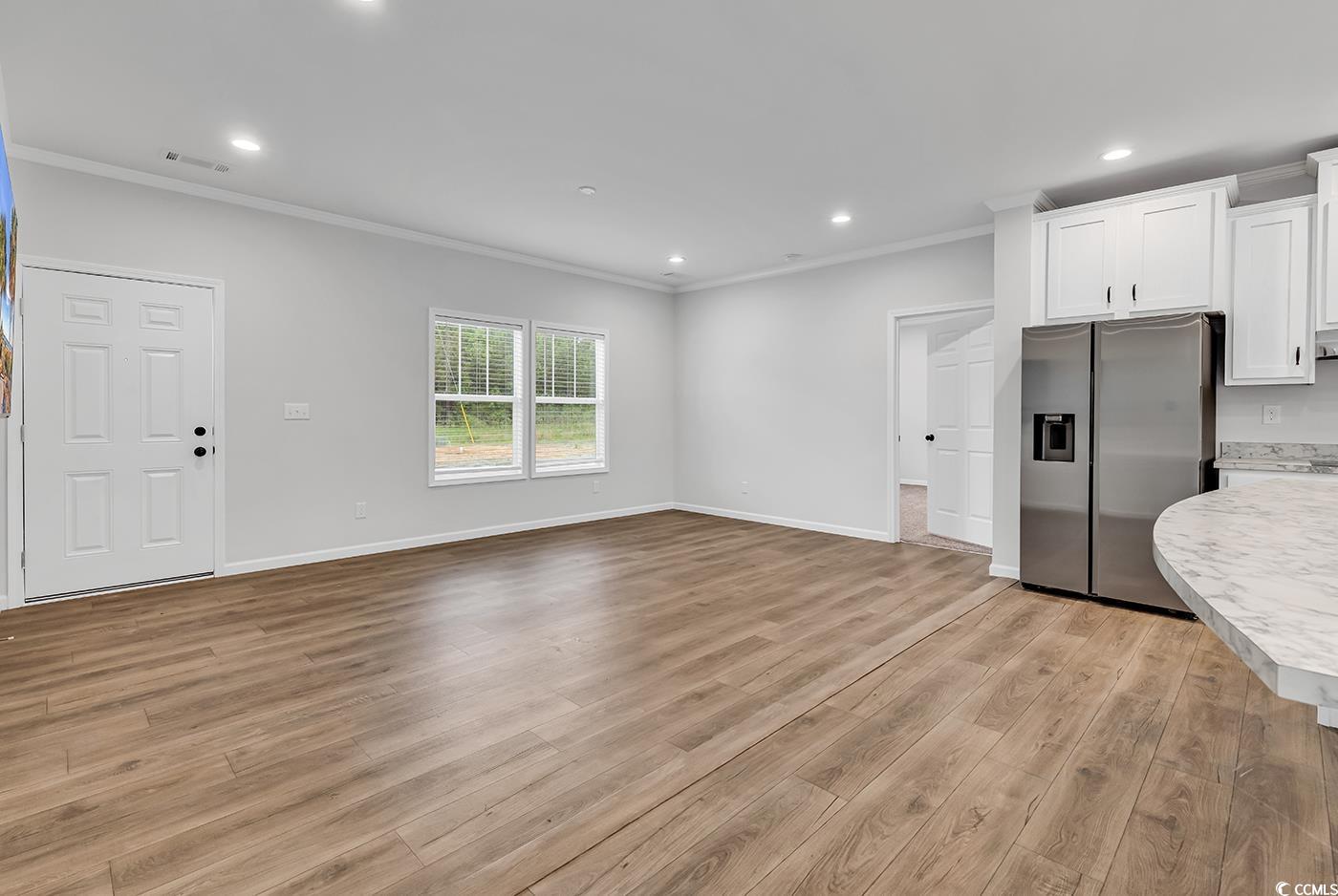 1529 Bucksport Road Conway, SC 29527 - Photo 4 of 31 Unfurnished living room with crown molding, recessed lighting, and light wood finished floors