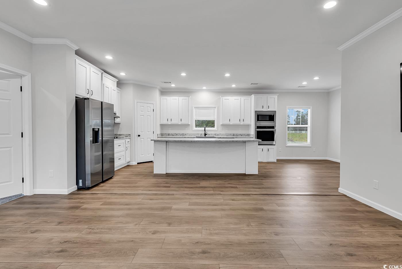 1529 Bucksport Road Conway, SC 29527 - Photo 10 of 31 Kitchen featuring stainless steel appliances, open shelves, crown molding, white cabinets, and recessed lighting