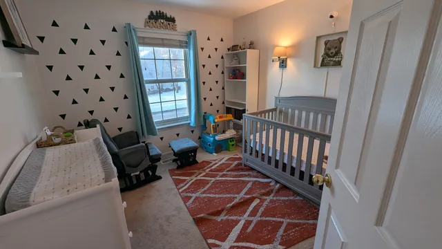 a view of a livingroom with furniture and staircase
