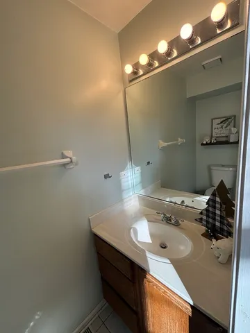 a bathroom with a sink and mirror