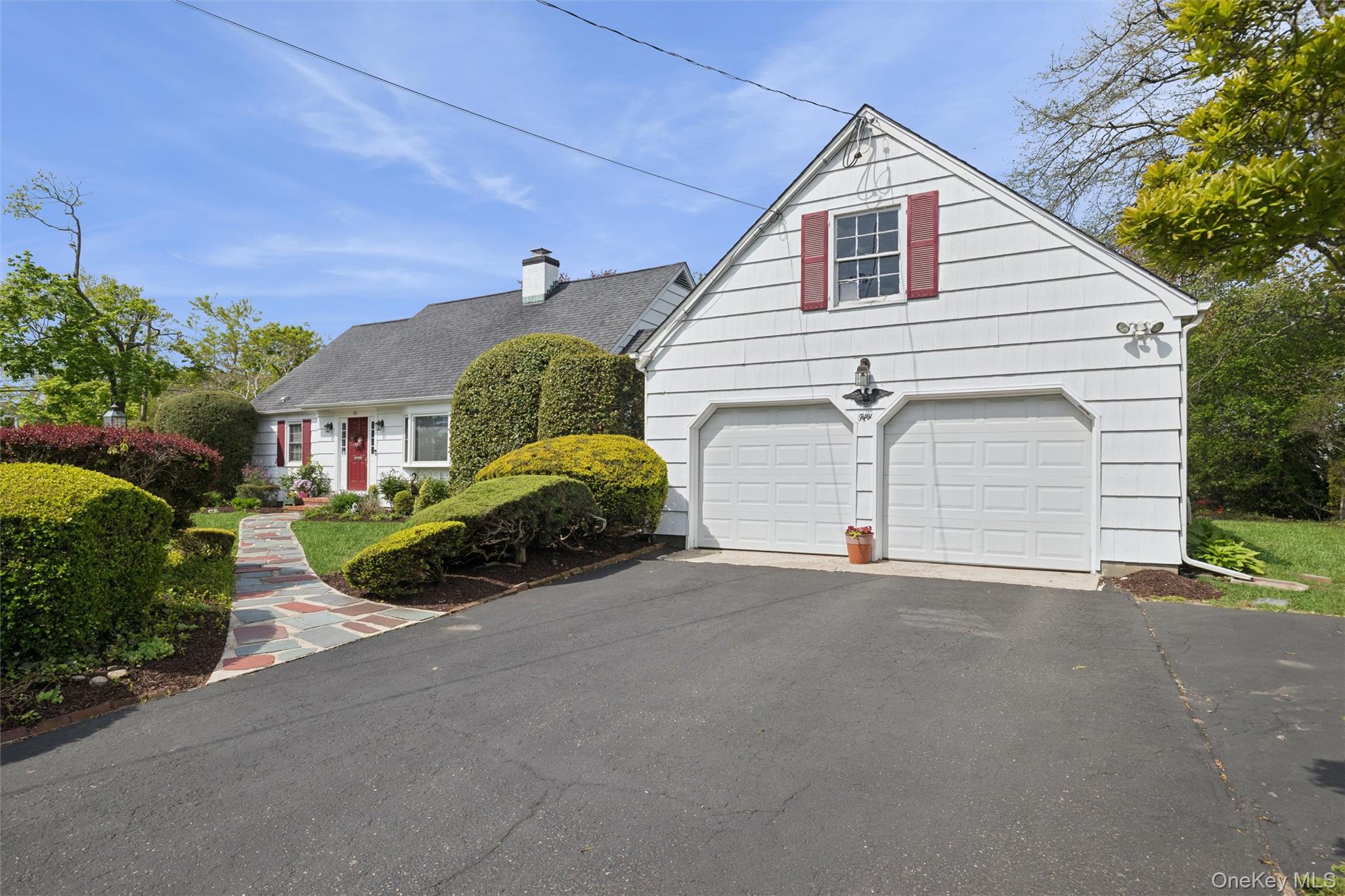 50 Belton Road Babylon, NY 11702 - Photo 5 of 34 Oversized 2 car garage with access directly into the laundry and kitchen area. Ample parking.