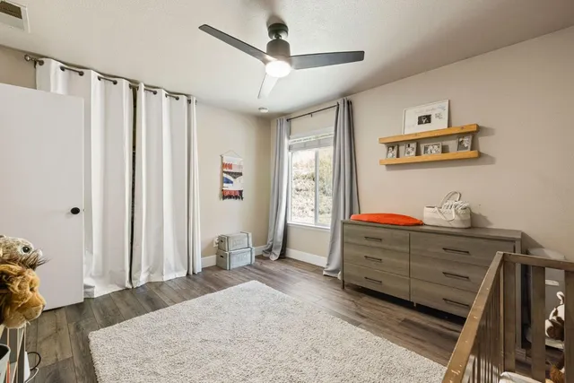 a bedroom with furniture and a window