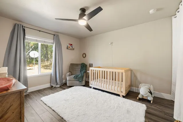 a bedroom with furniture and a window
