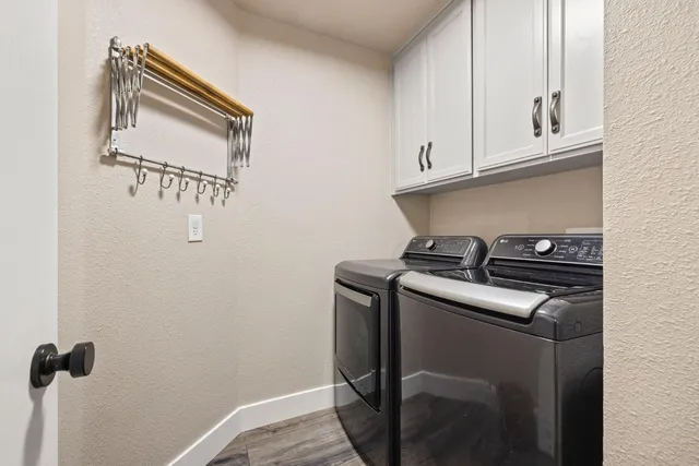 a bathroom with a granite countertop toilet a sink and mirror
