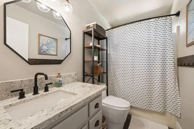 a room with a stove and a wooden door