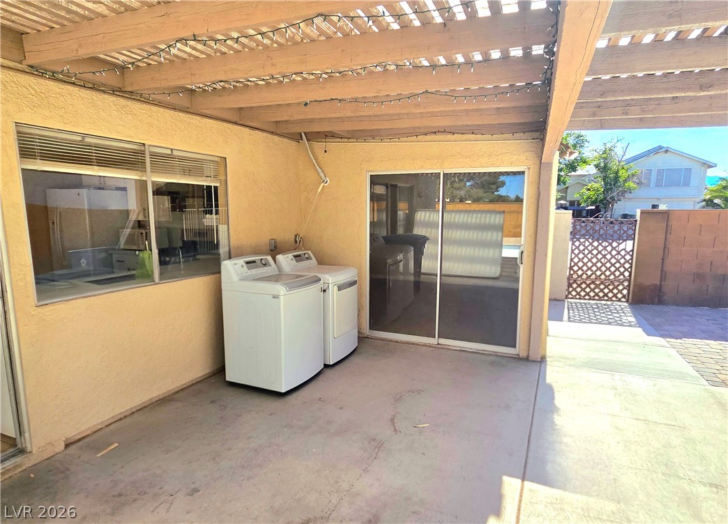3648 Bronco Road Las Vegas, NV 89103 - Photo 14 of 24 A private, covered patio with outdoor laundry provides a versatile exterior living space.