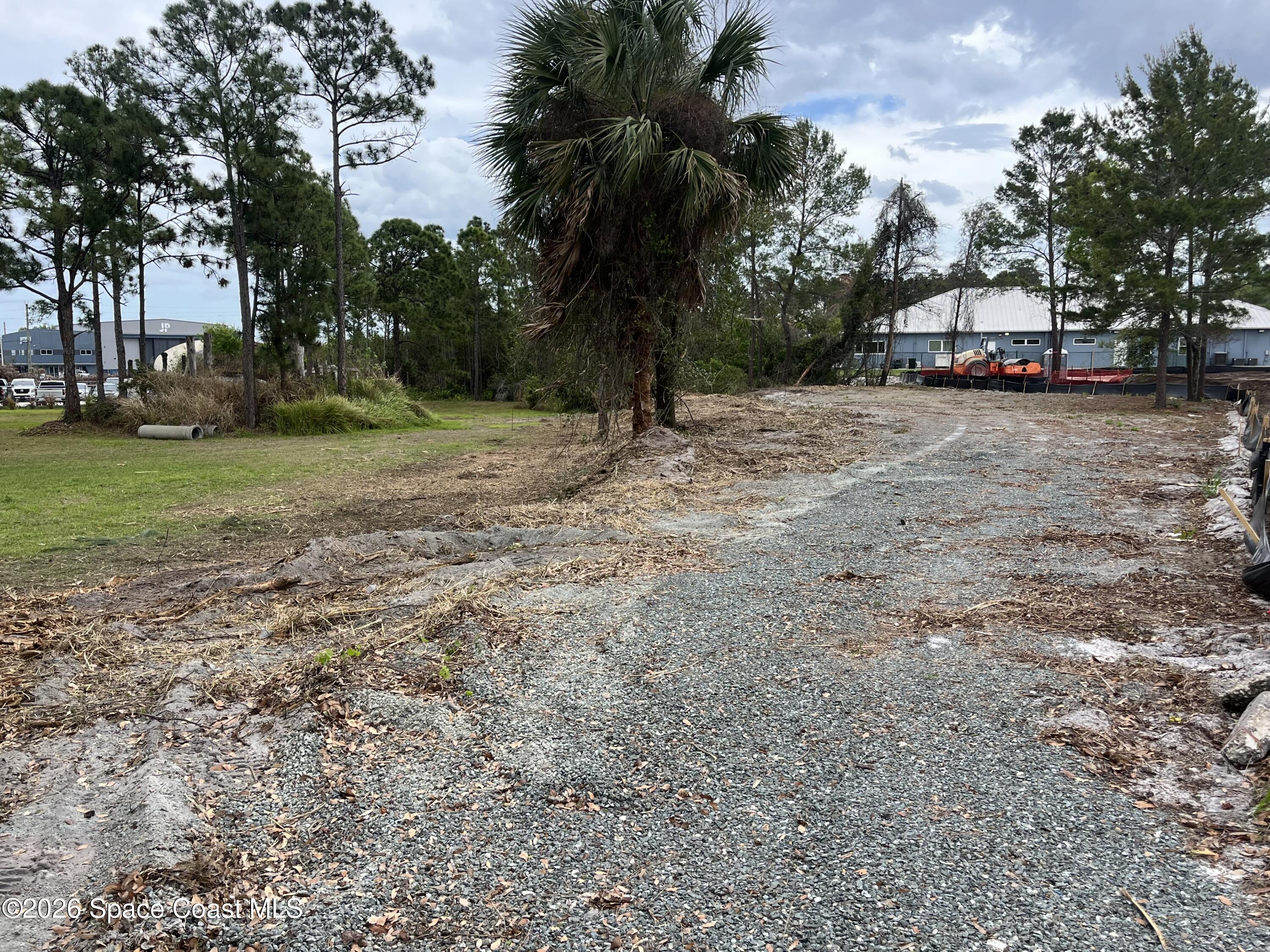 275 Paint Street Rockledge, FL 32955 - Photo 17 of 18 a view of street with houses and trees
