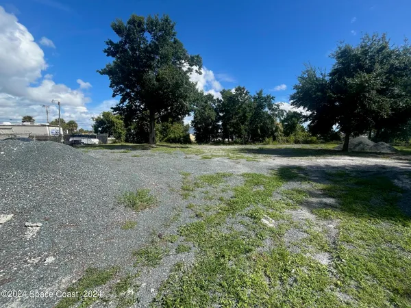 a view of outdoor space with trees all around