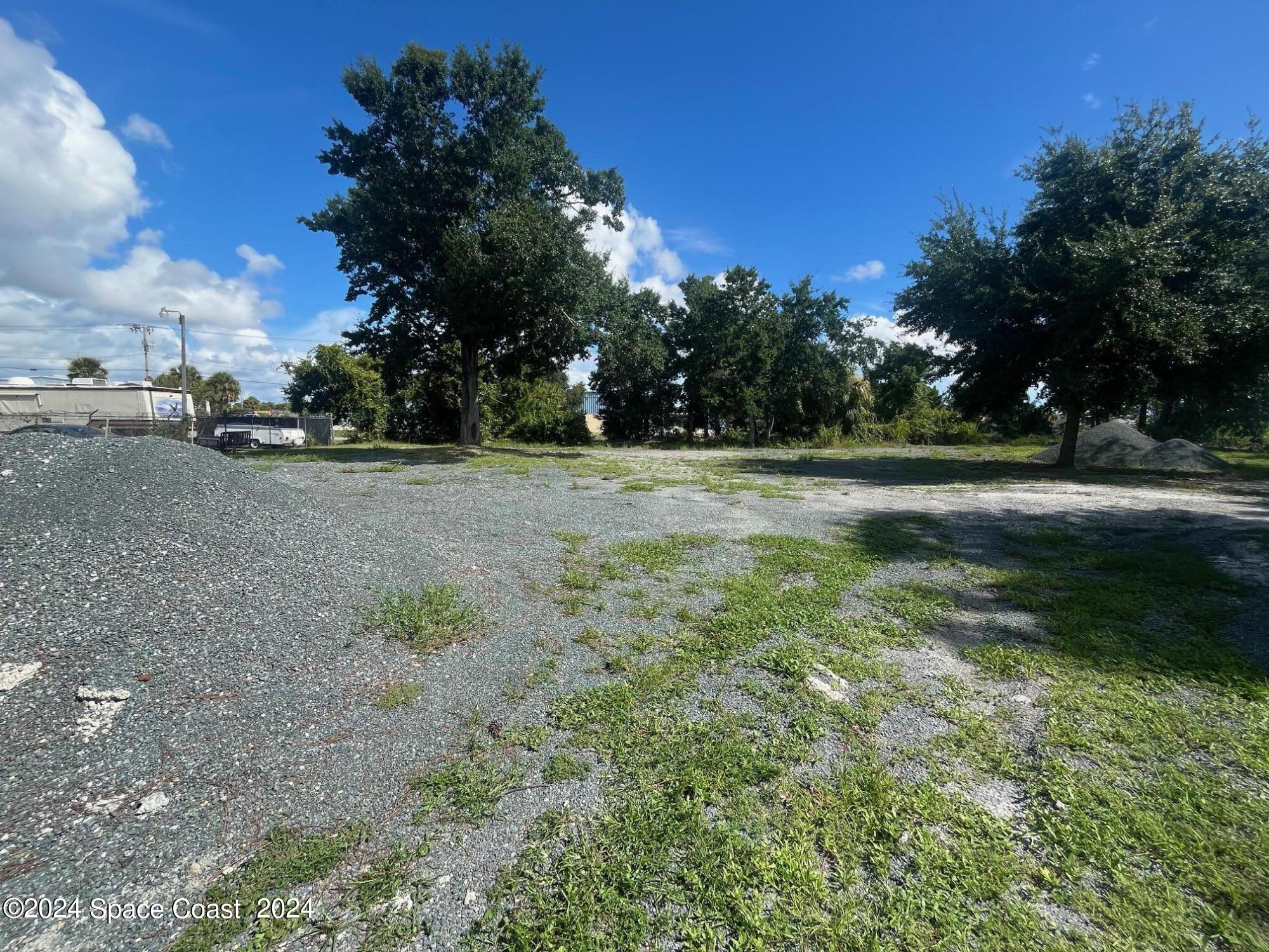 275 Paint Street Rockledge, FL 32955 - Photo 7 of 18 a view of outdoor space with trees all around
