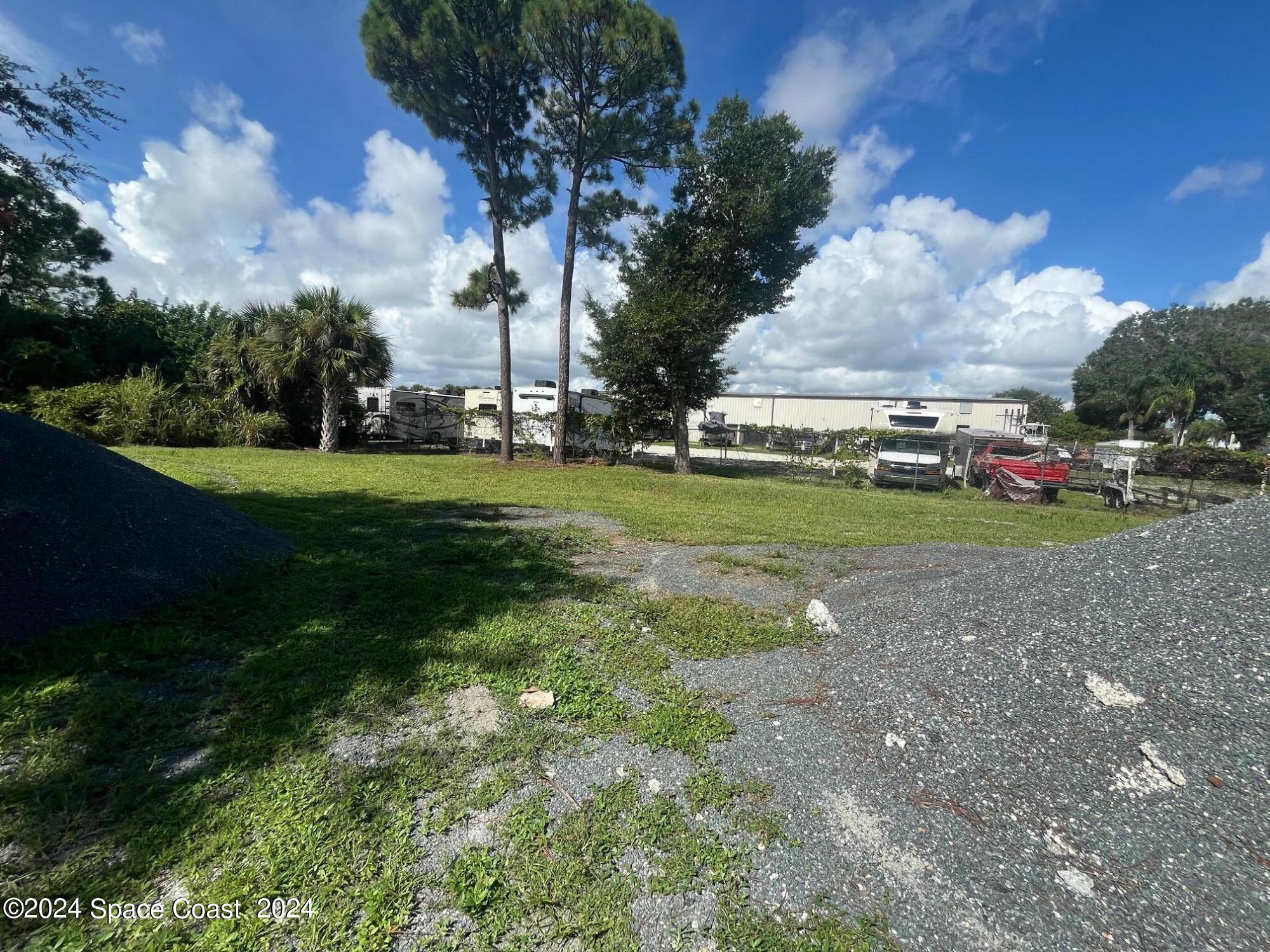 275 Paint Street Rockledge, FL 32955 - Photo 8 of 18 a view of a field with large trees